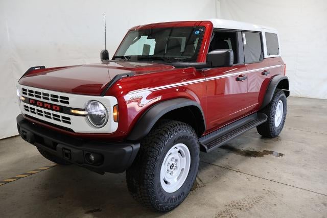 2026 Ford Bronco Heritage Edition in Ruby Red Metallic Tinted Clearcoat — front three-quarter view