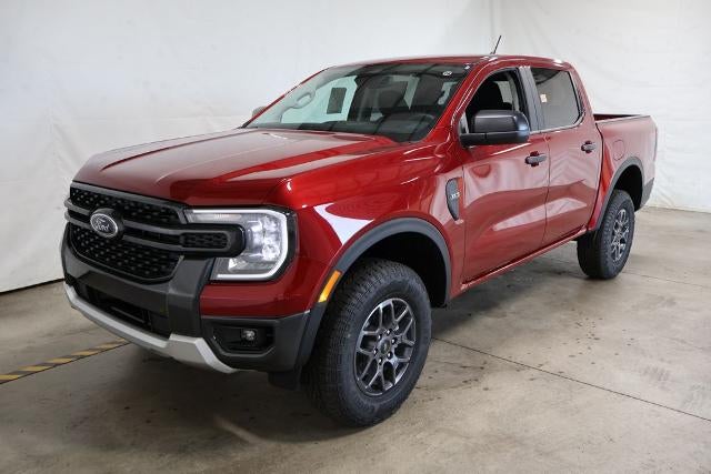 2026 Ford Ranger XLT in Ruby Red Metallic Tinted Clearcoat — front three-quarter view