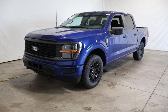 2026 Ford F-150 STX Demo in Argon Blue Metallic — front three-quarter view