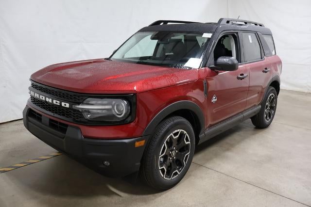 2026 Ford Bronco Sport Outer Banks Demo in Ruby Red Metallic Tinted Clearcoat — front three-quarter view
