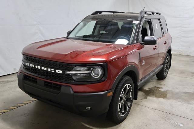 2025 Ford Bronco Sport Outer Banks in Ruby Red Metallic Tinted Clearcoat — front three-quarter view