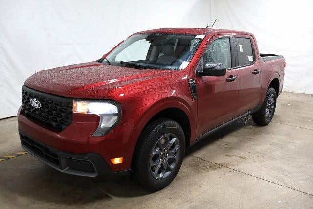 2026 Ford Maverick XLT Demo in Ruby Red Metallic Tinted Clearcoat — front three-quarter view