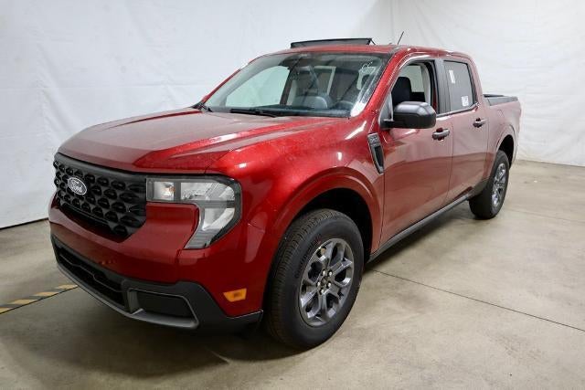2026 Ford Maverick XLT Demo in Ruby Red Metallic Tinted Clearcoat — front three-quarter view