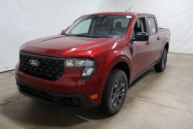 2026 Ford Maverick XLT Demo in Ruby Red Metallic Tinted Clearcoat — front three-quarter view