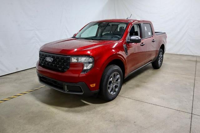2026 Ford Maverick XLT Demo in Ruby Red Metallic Tinted Clearcoat — front three-quarter view