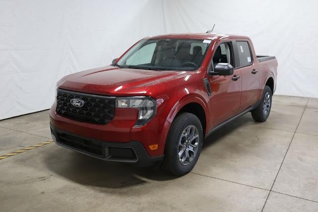2026 Ford Maverick XLT Demo in Ruby Red Metallic Tinted Clearcoat — front three-quarter view