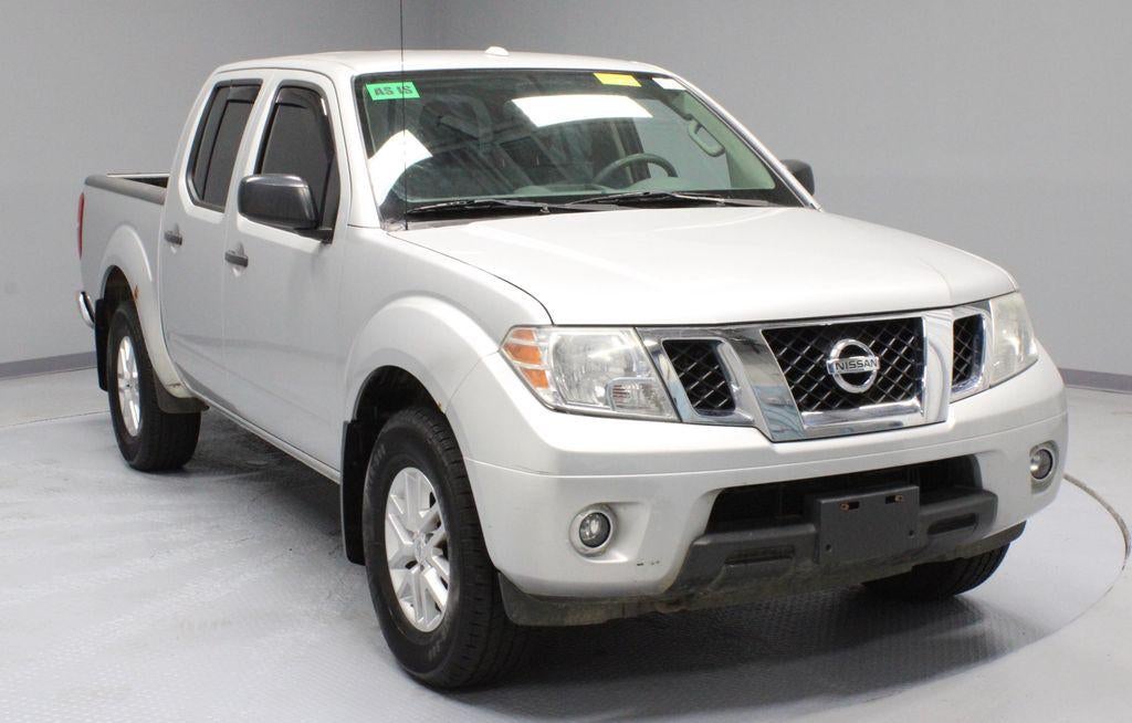 2015 Nissan Frontier SV in Brilliant Silver — front three-quarter view