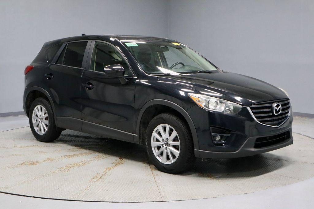 2016 Mazda Mazda CX-5 Touring in Jet Black Mica — front three-quarter view