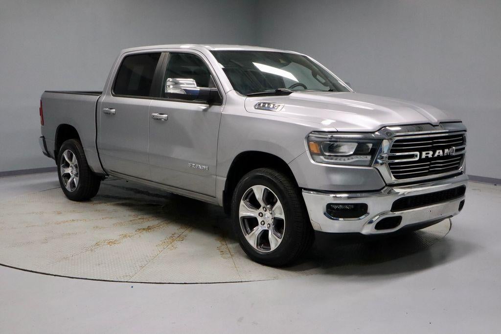 2023 RAM 1500 Laramie 4x4 Crew Cab 5'7" Box in Billet Silver Metallic Clearcoat — front three-quarter view