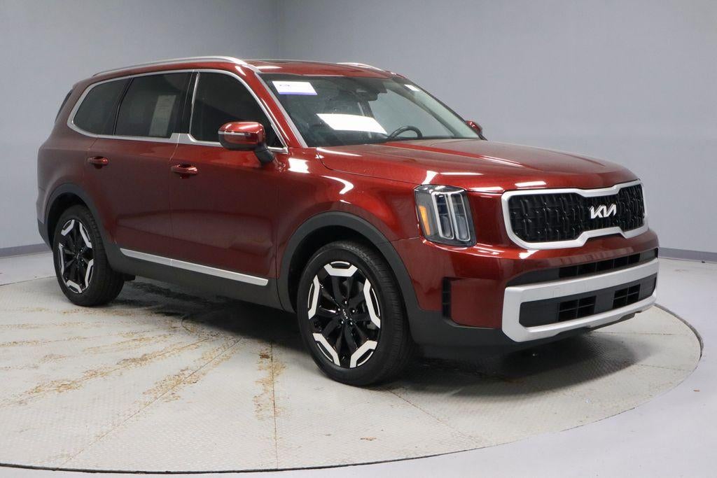 2024 Kia Telluride EX AWD in Dawning Red — front three-quarter view