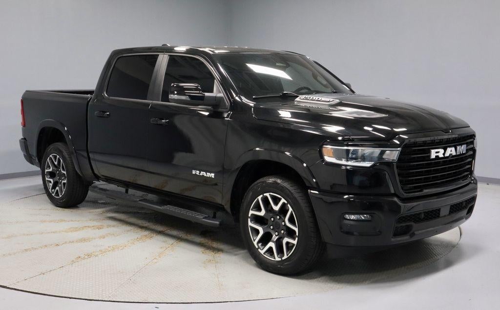 2025 RAM 1500 Laramie in Diamond Black Crystal Pearlcoat — front three-quarter view