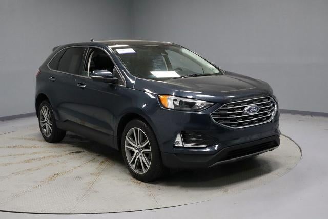 2022 Ford Edge Titanium in Stone Blue Metallic — front three-quarter view