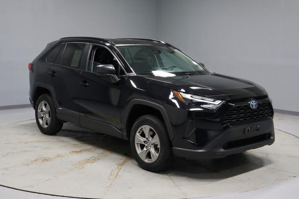 2024 Toyota RAV4 LE in Midnight Black Metallic — front three-quarter view