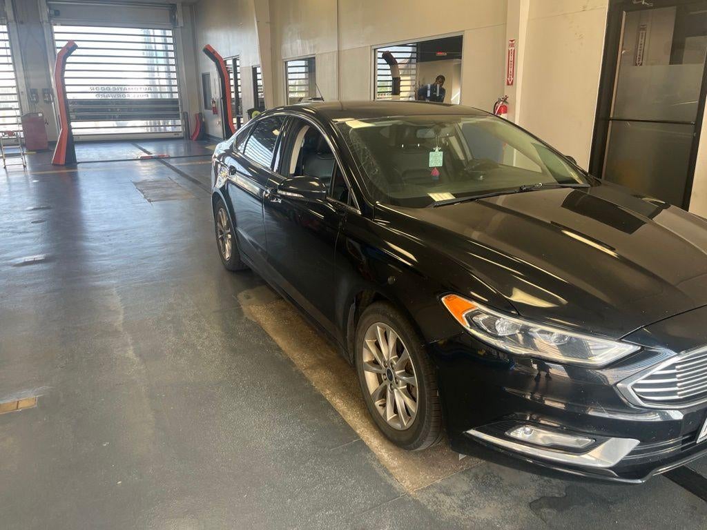 2017 Ford Fusion SE in Shadow Black — front three-quarter view