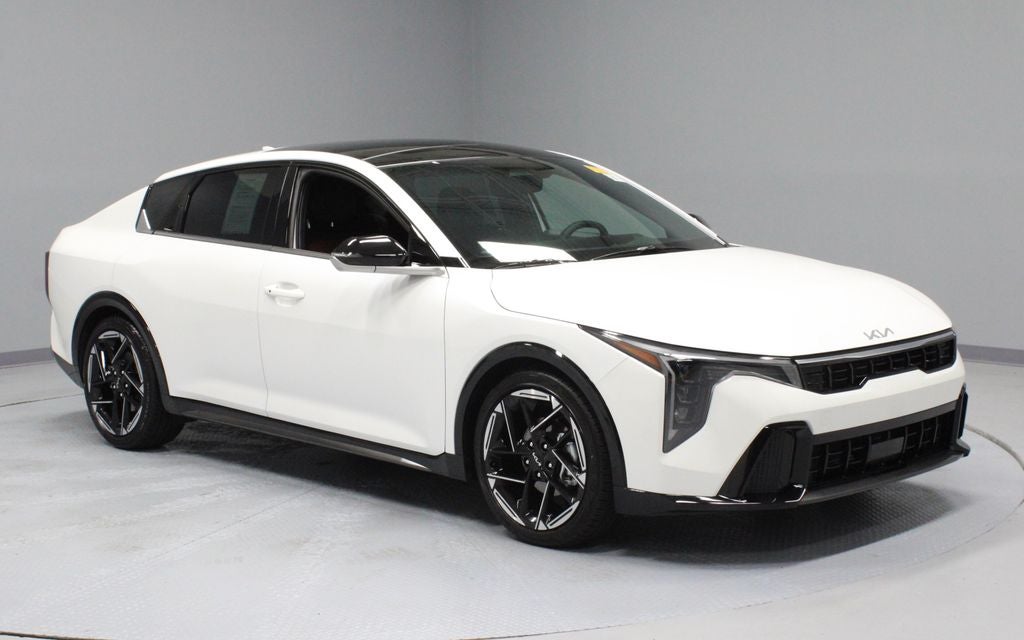 2025 Kia K4 GT-Line in Snow White Pearl — front three-quarter view