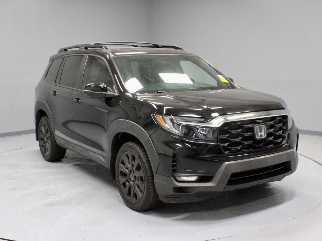 2023 Honda Passport EX-L in Crystal Black Pearl — front three-quarter view