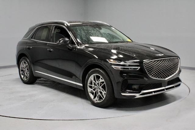 2024 Genesis GV70 2.5T Advanced in Vik Black — front three-quarter view