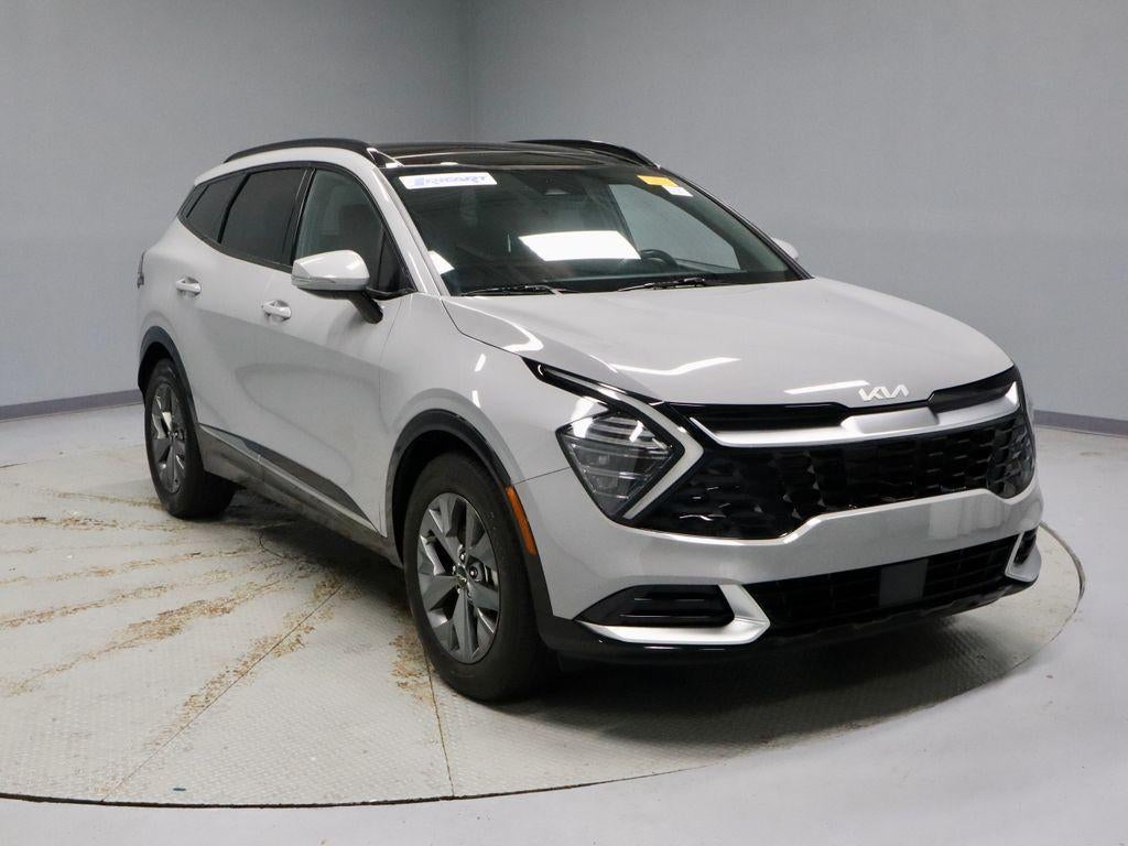 2024 Kia Sportage SX in Wolf Gray — front three-quarter view