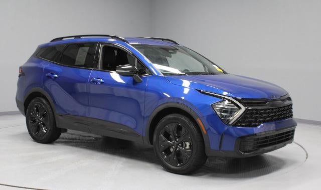 2025 Kia Sportage X-Line in Sapphire Blue — front three-quarter view