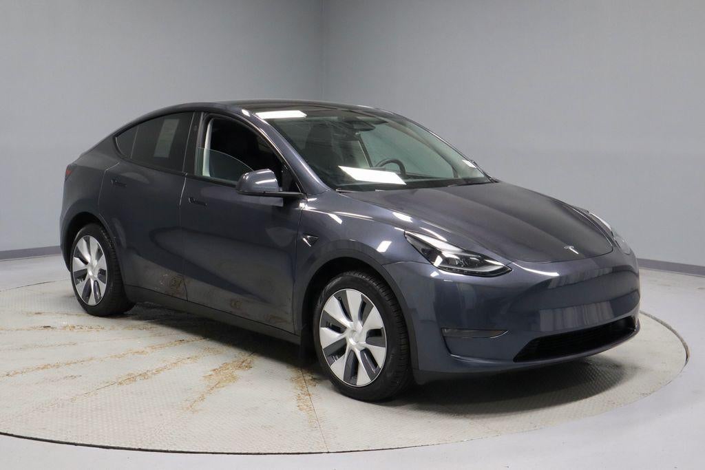 2024 Tesla Model Y Long Range in Stealth Gray — front three-quarter view
